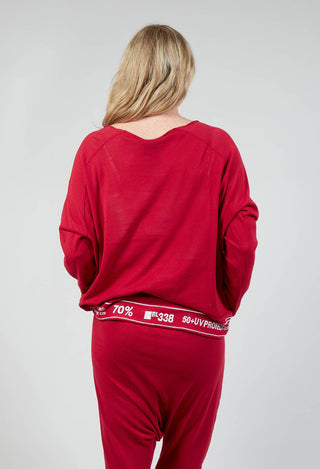 Jumper with Hemline Lettering in Chili Jacquard