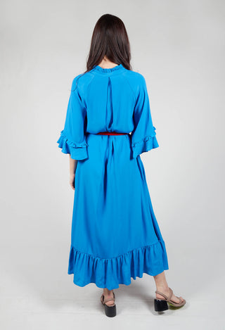 behind shot of blue dress with contrasting belt and bell sleeves