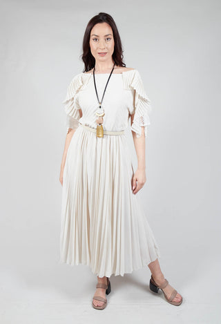lady wearing a neutral maxi dress with waist belt