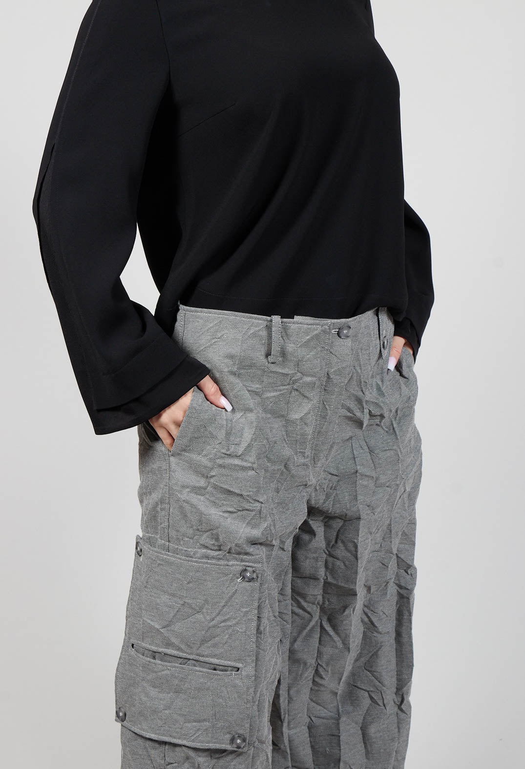 close up of ladies grey wide leg trousers with side pockets
