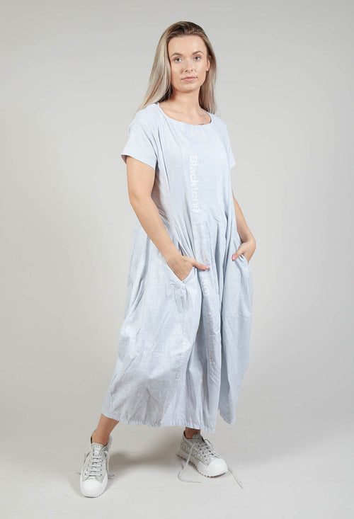 Short Sleeve Dress with Tulip Hem in Placed Grey Print