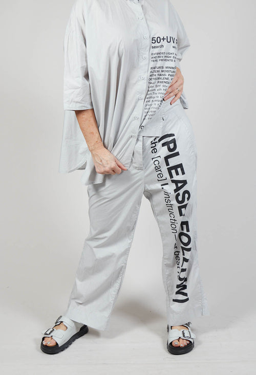 Wide Leg Trousers with Lettering Motif in Grey Print