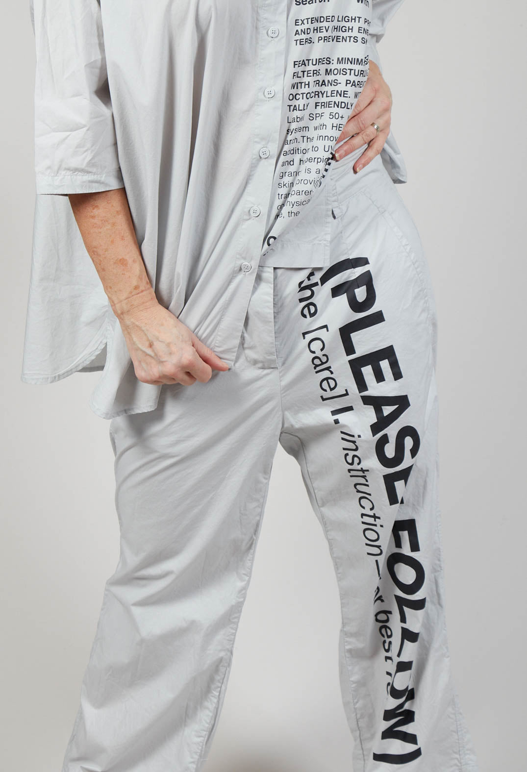Wide Leg Trousers with Lettering Motif in Grey Print