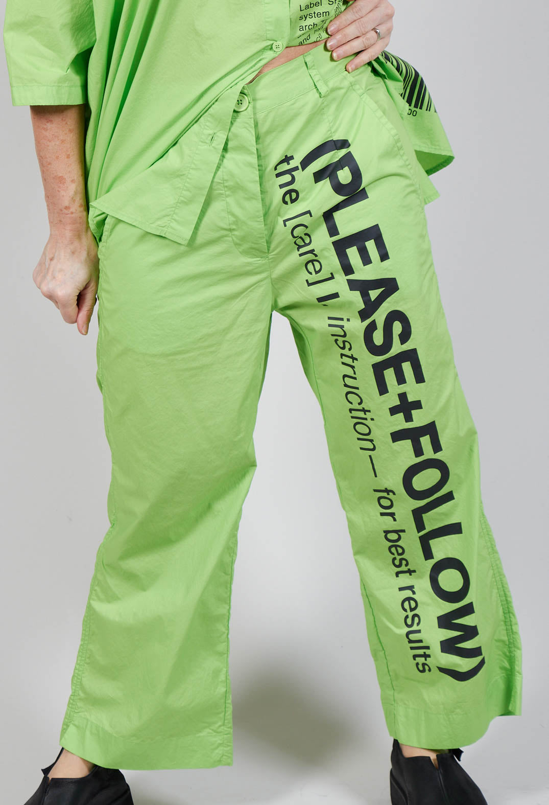 Wide Leg Trousers with Lettering Motif in Lime Print