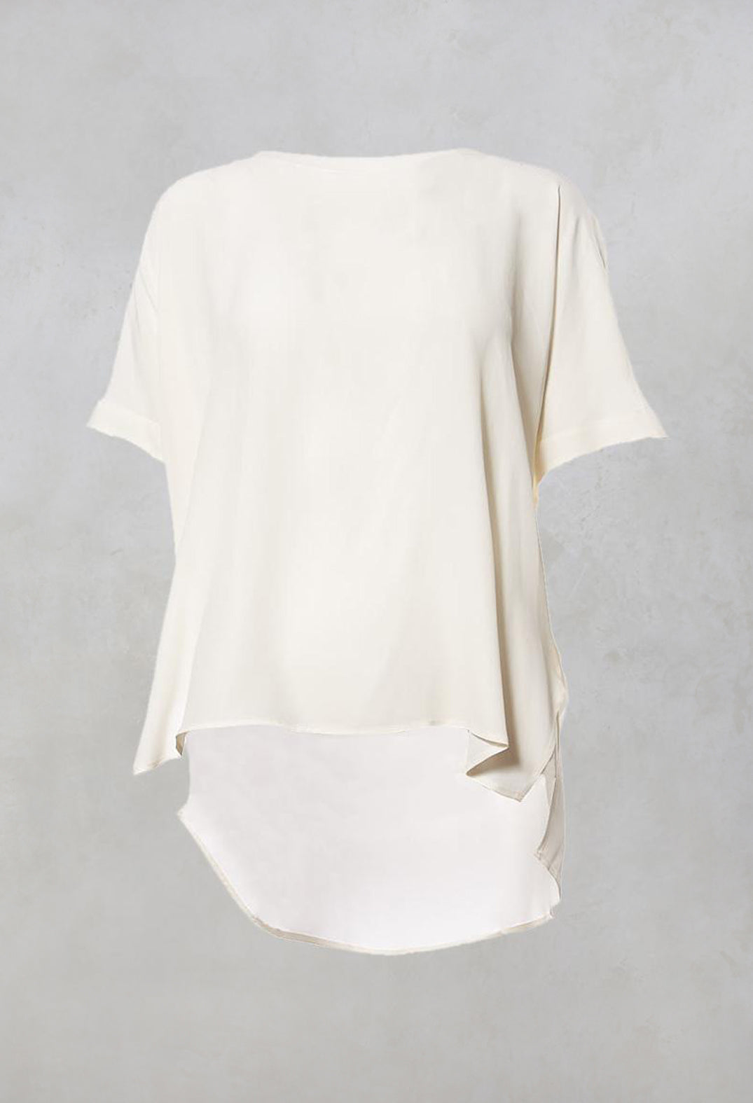 cream silk blouse with wide neck and short sleeves