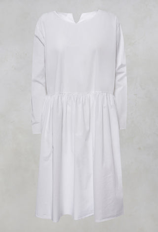 Koci Long Sleeve Smock Dress with Pockets in Bianco