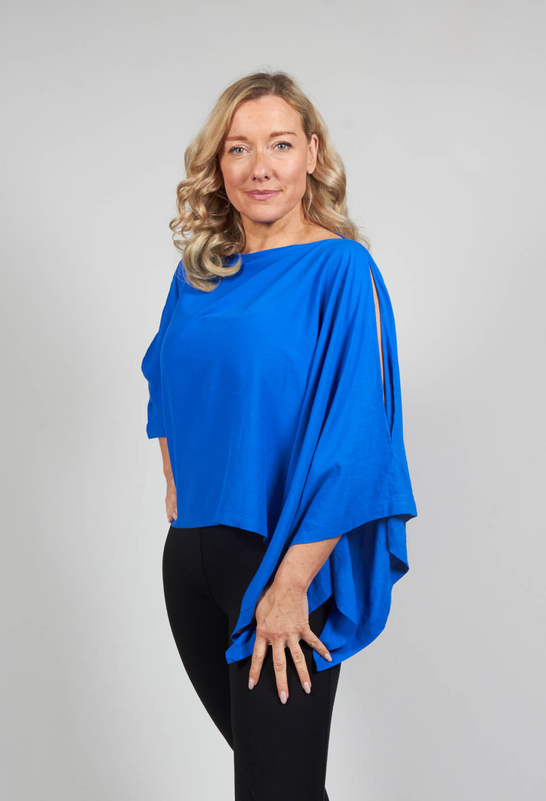 Cropped Cape Style Top with Cut Out Shoulder in Blue