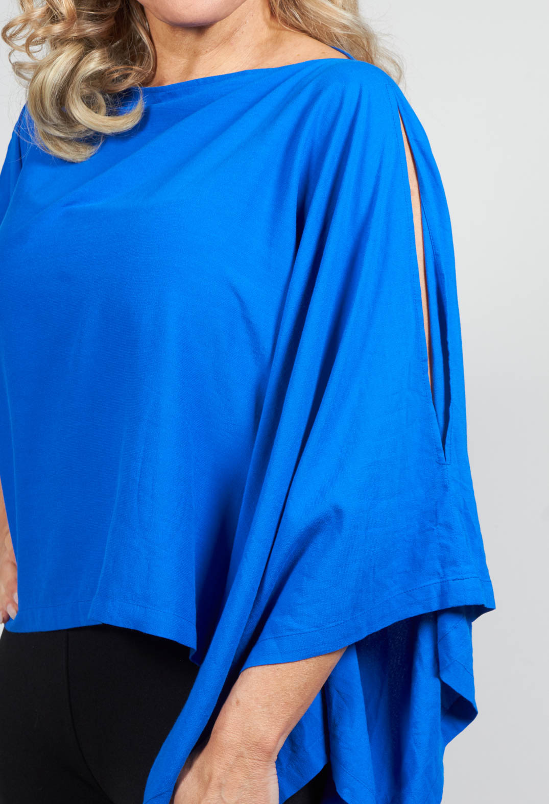 Cropped Cape Style Top with Cut Out Shoulder in Blue