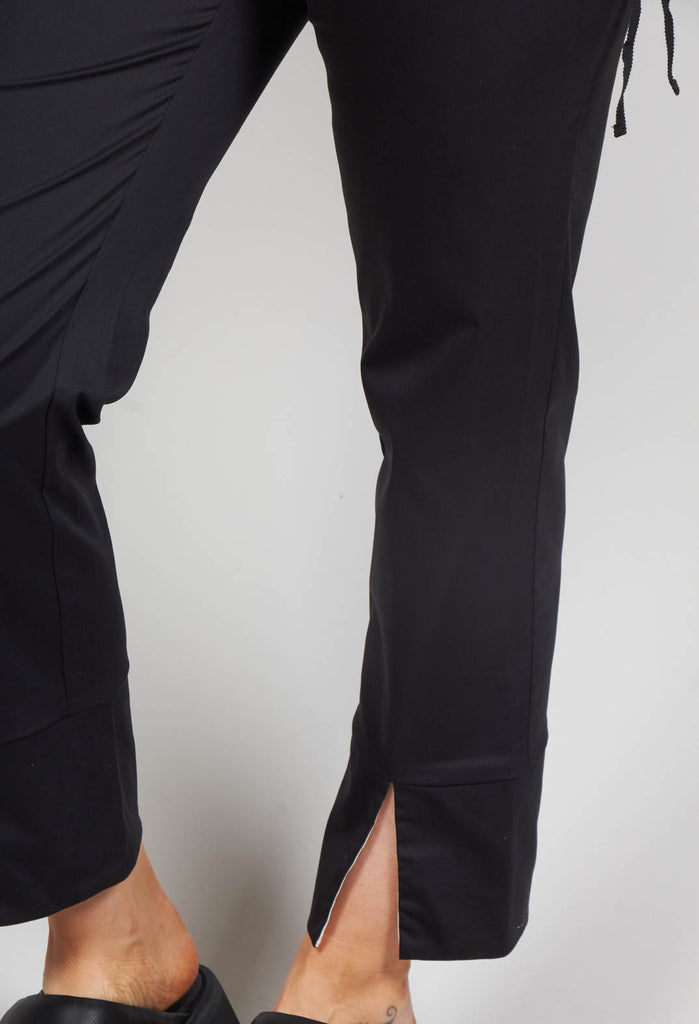 black tailored trousers with split bottom hems 