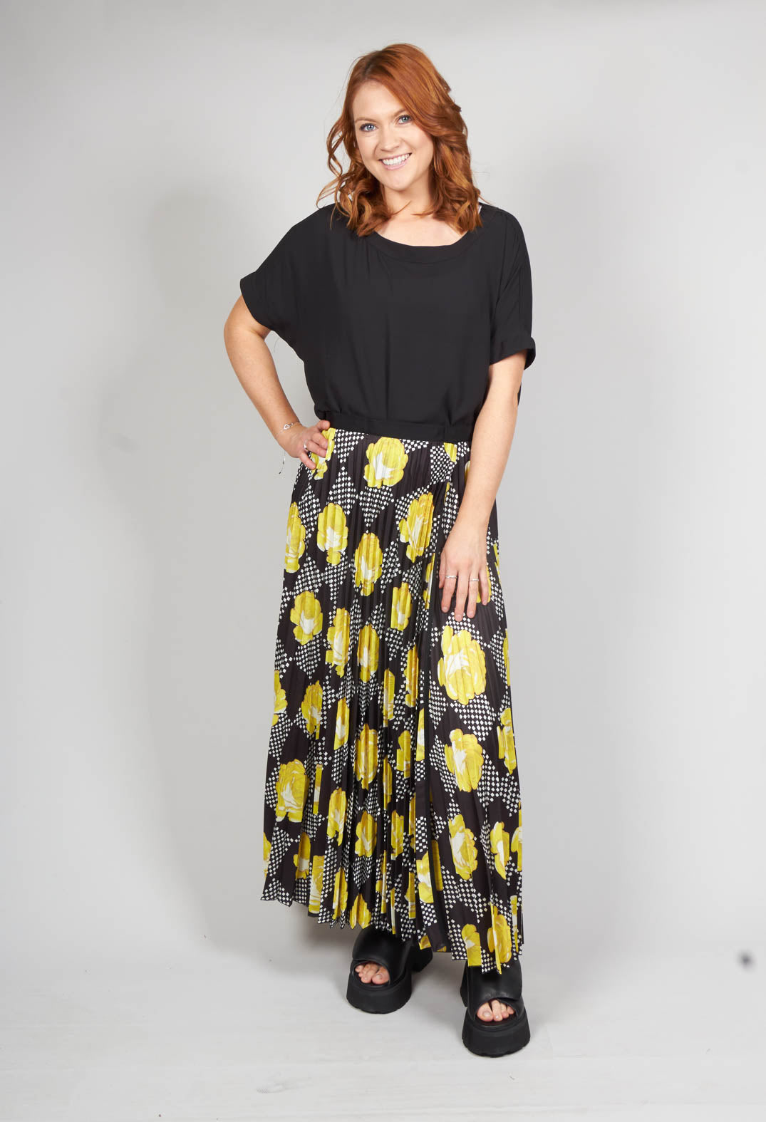 yellow pleated midi skirt