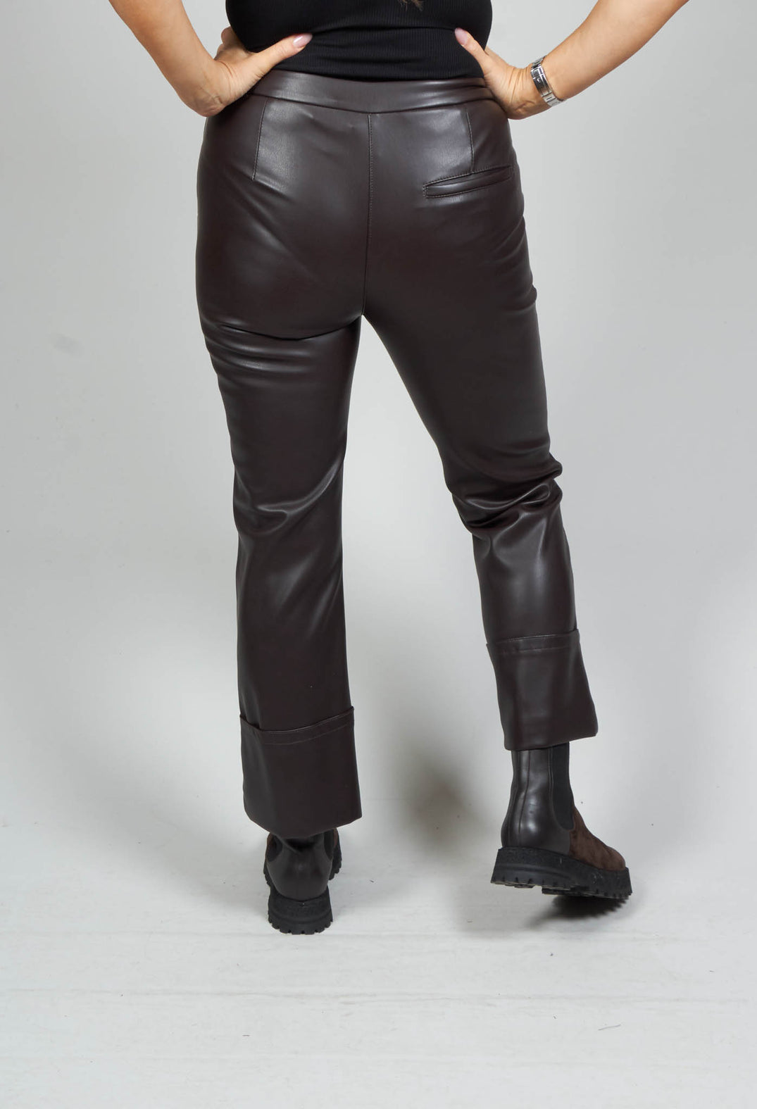back detail of espresso brown leather trousers with pockets