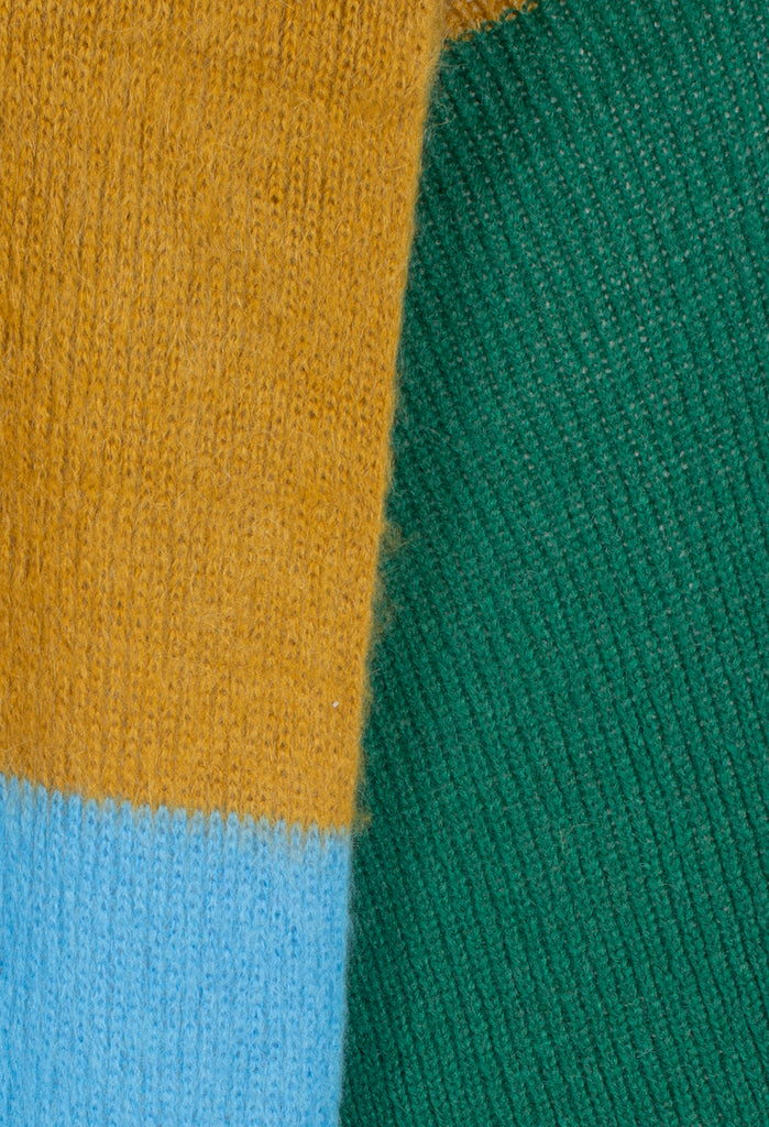 close up of knitted scarf in blue