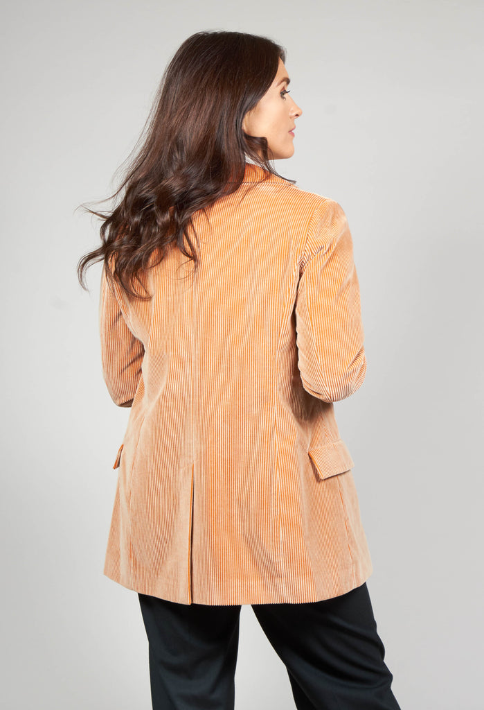 behind shot of beatrice b corduroy jacket in peach