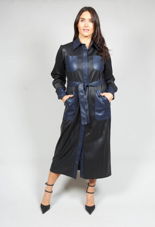 lady wearing a long faux leather dress in navy