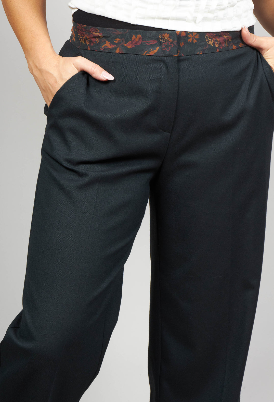 green tailored trousers with a floral trim