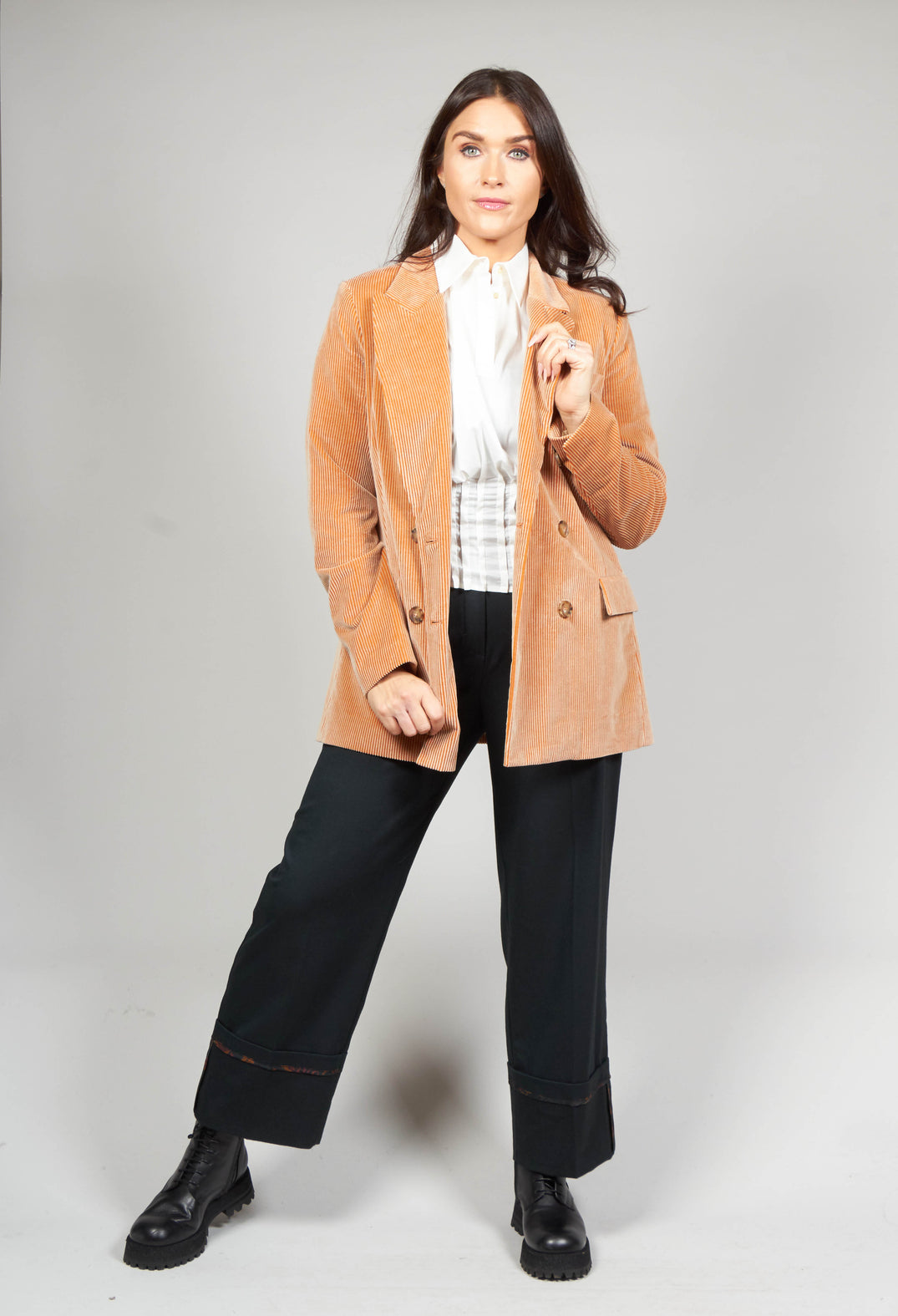 lady wearing dark green tailored trousers