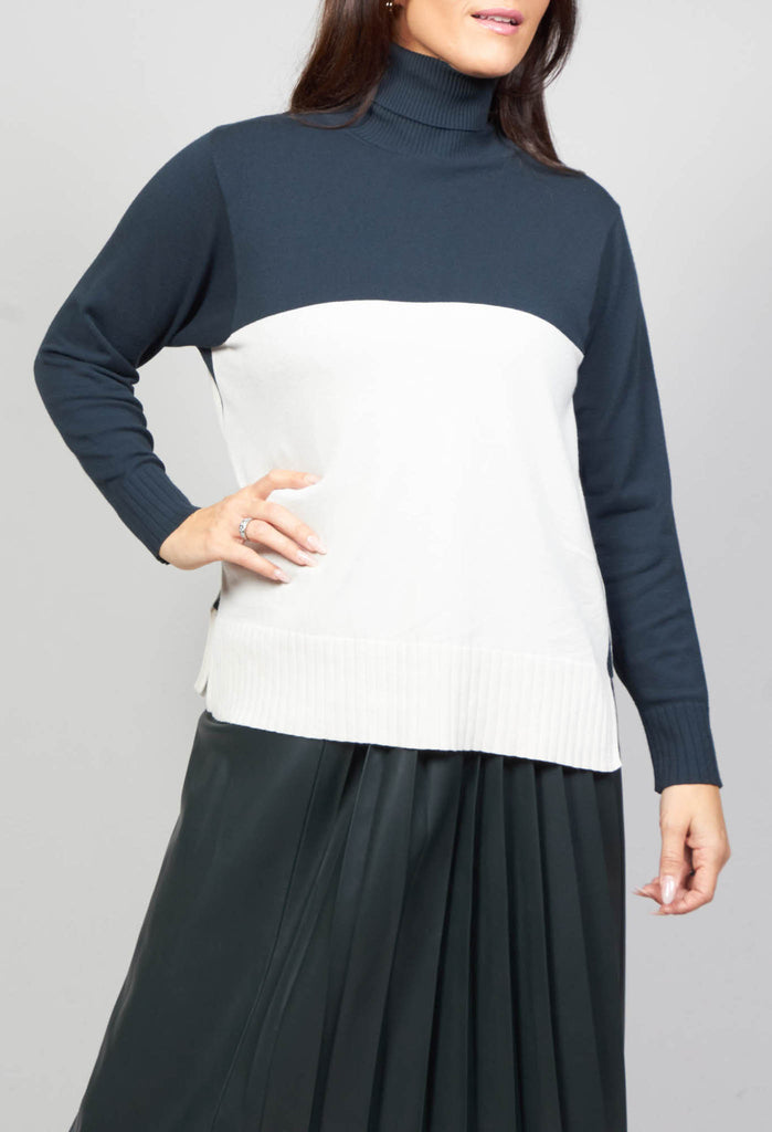 lady wearing a polo neck in peacock green