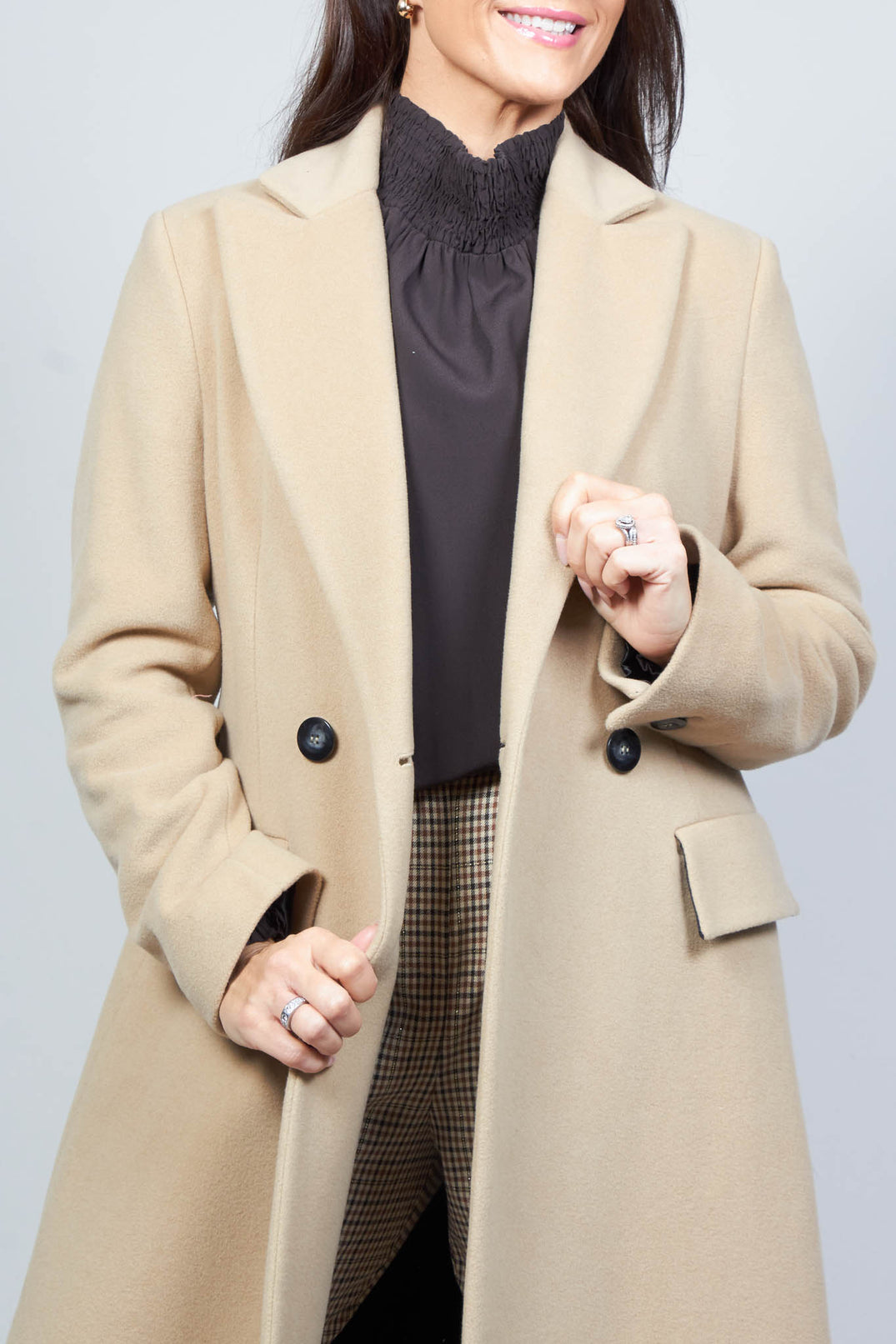 close up of tailored duster coat in camel