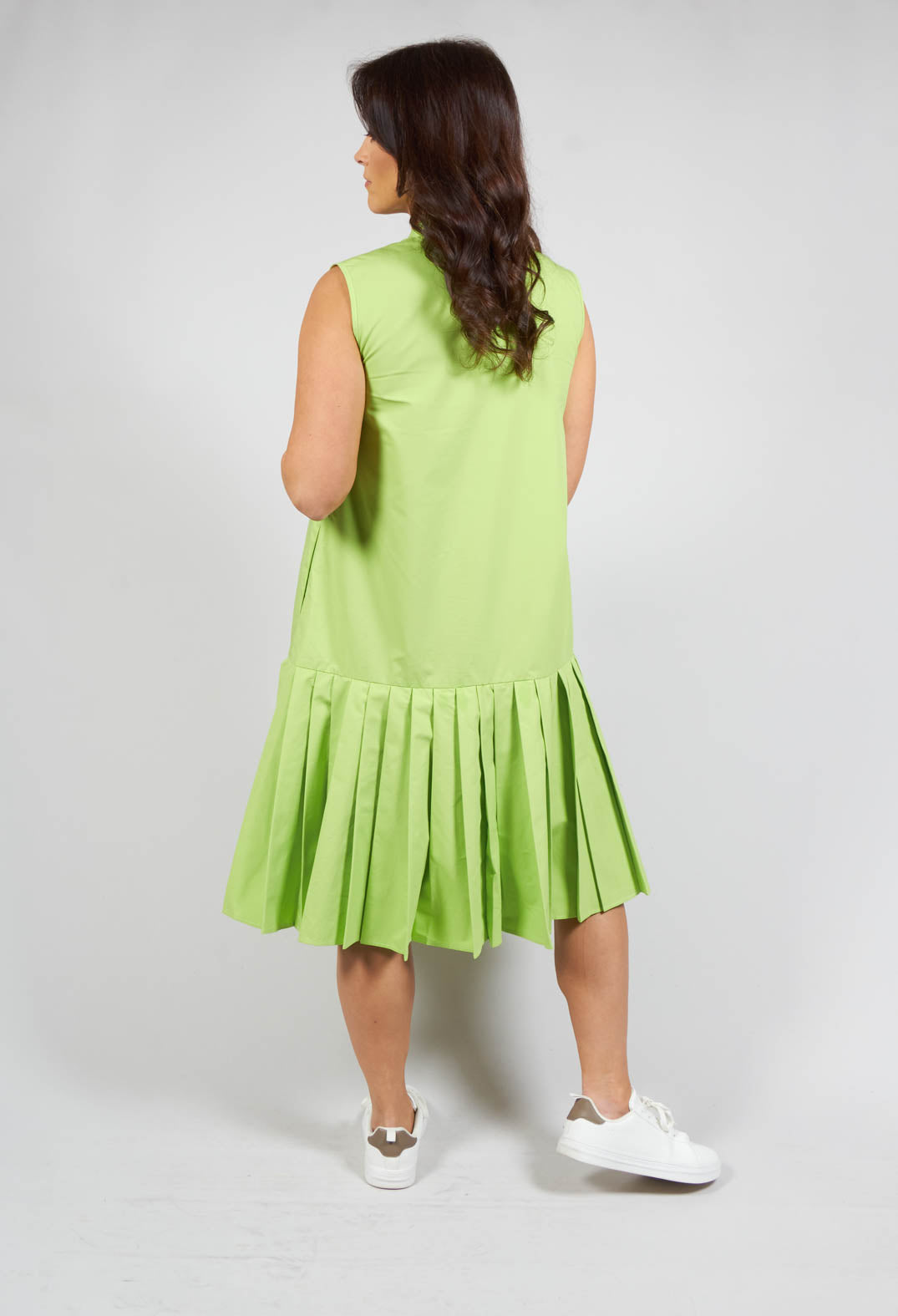 back detailing of sleeveless dress with pleated hem in green