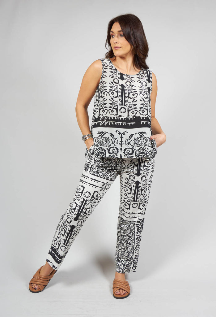 lady wearing a black print vest top 