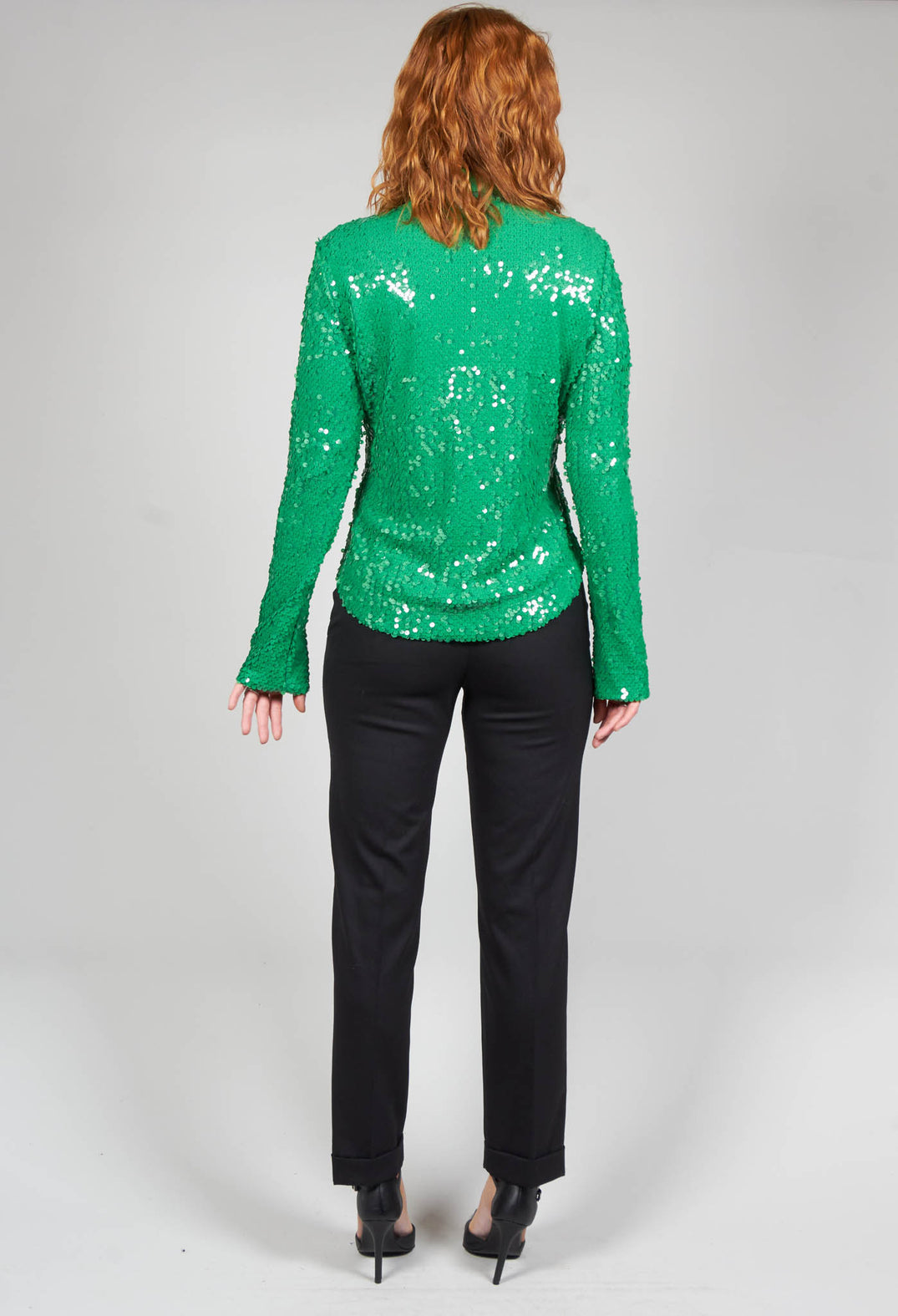behind shot of green sequin blouse