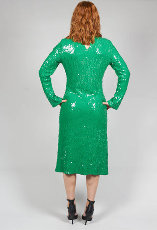 behind shot of green sequin dress on a lady