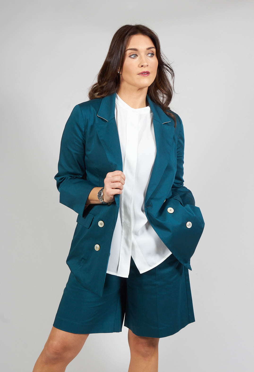 green tailored jacket with collar detail and button fastening