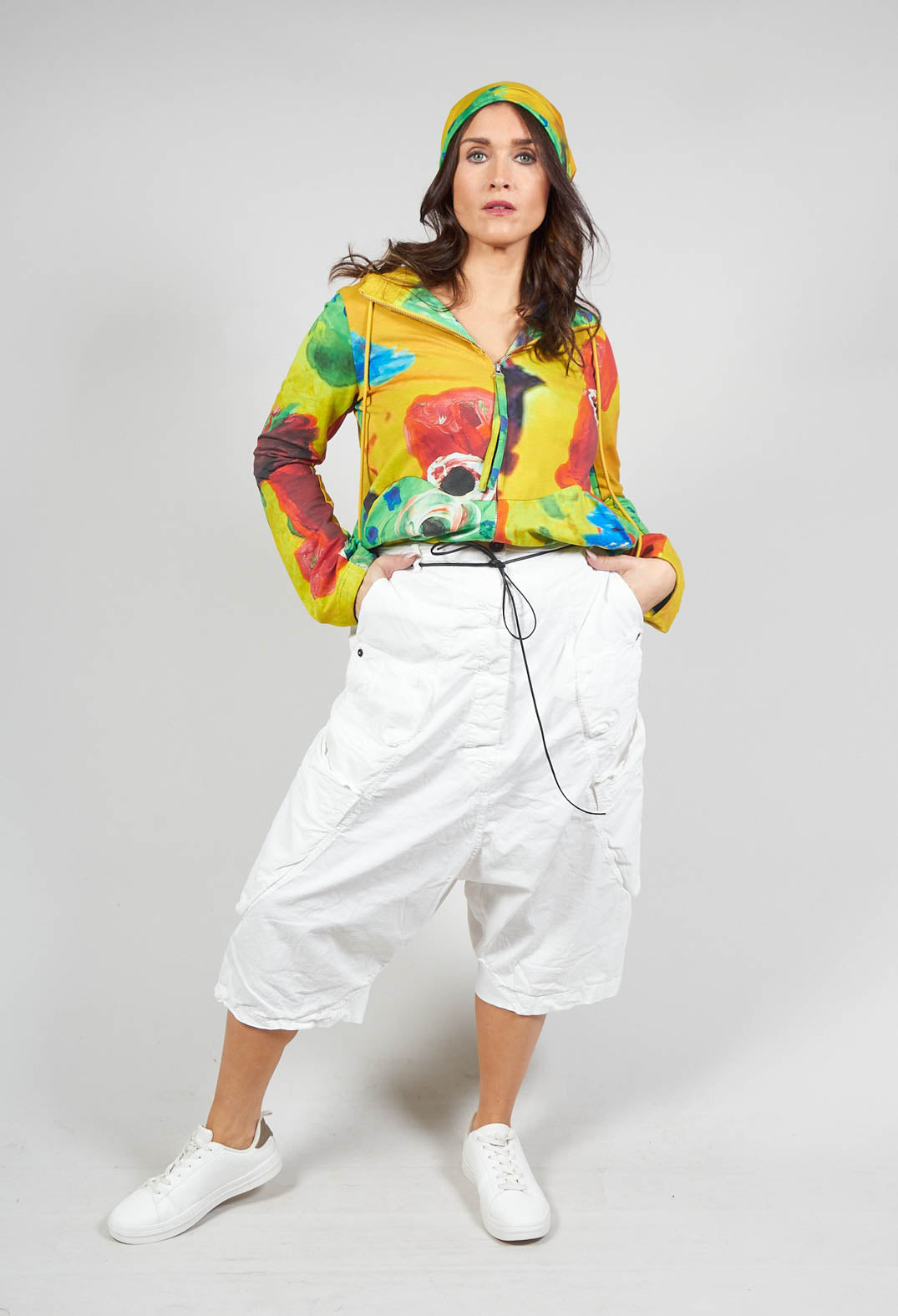 lady wearing cropped leg drop crotch trousers in star white