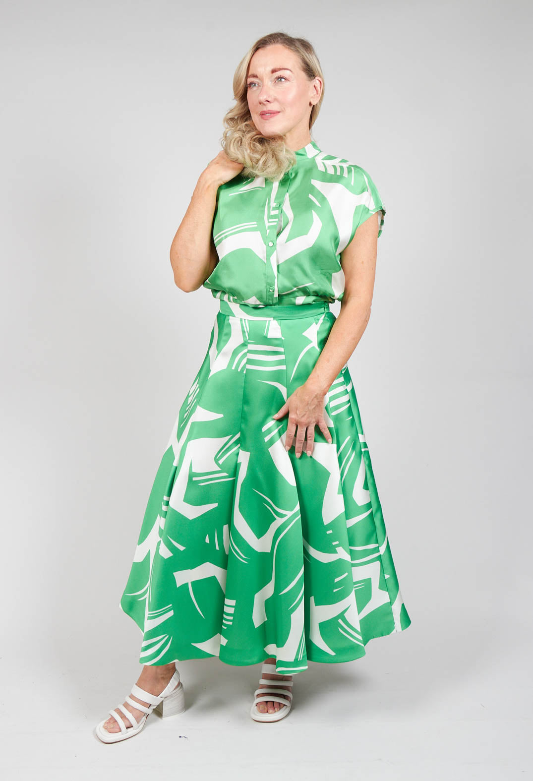 lady wearing a green a-line pleated skirt