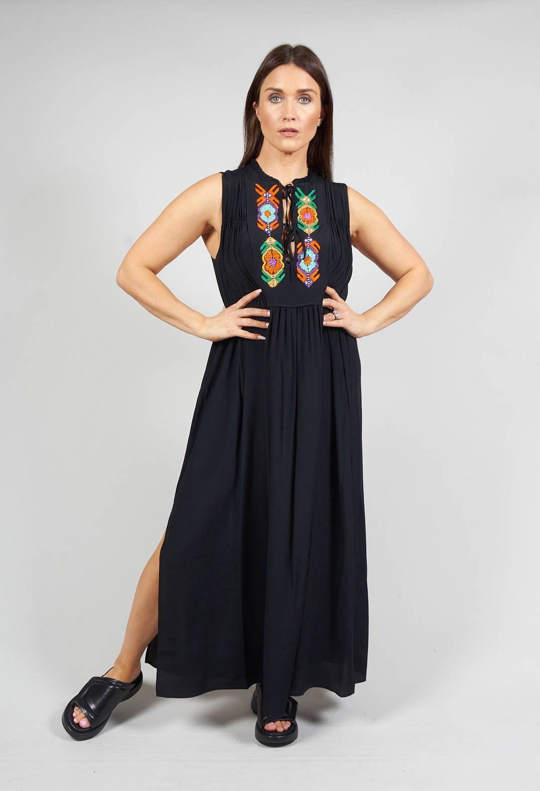 lady wearing black Beatrice B maxi dress with embellished detail