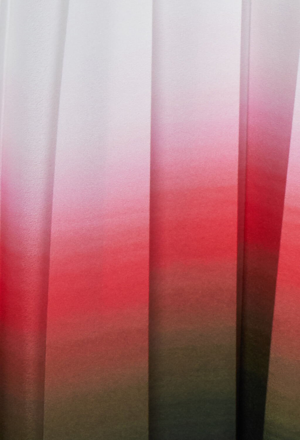 faded pink colours on a pleated skirt