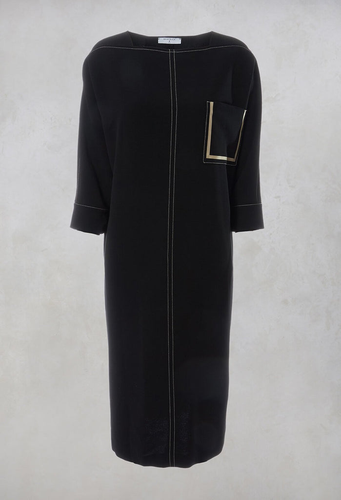 black shift dress with a front pocket