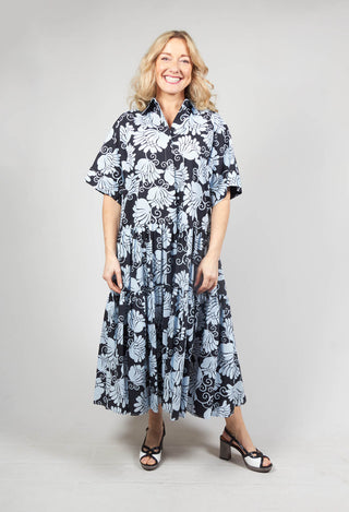 smiling lady wearing a Beatrice B shirt dress in bloom print