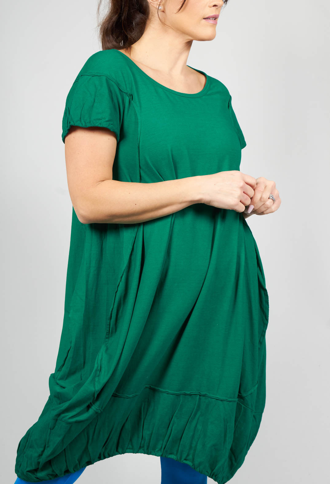 green jersey dress with short sleeves and gathered hem