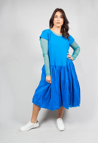 lady wearing a blue short sleeved jersey dress with gathered waist detail