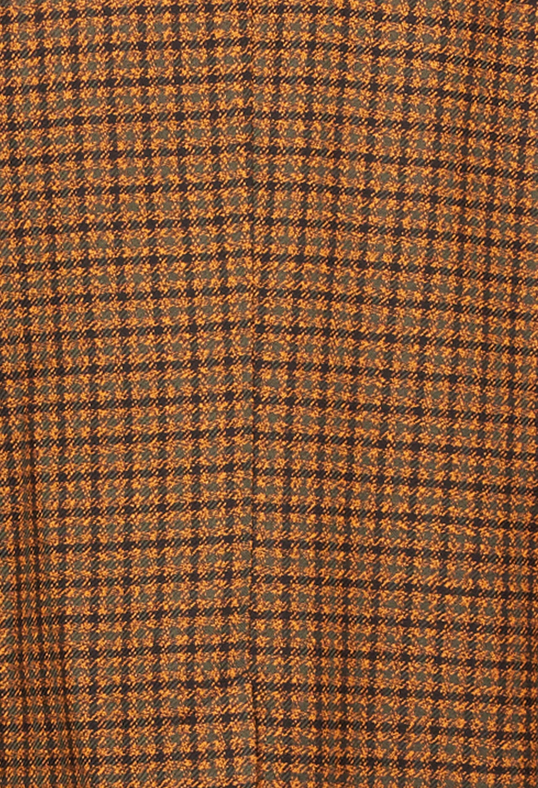 close up shot of orange print houndstooth jacket