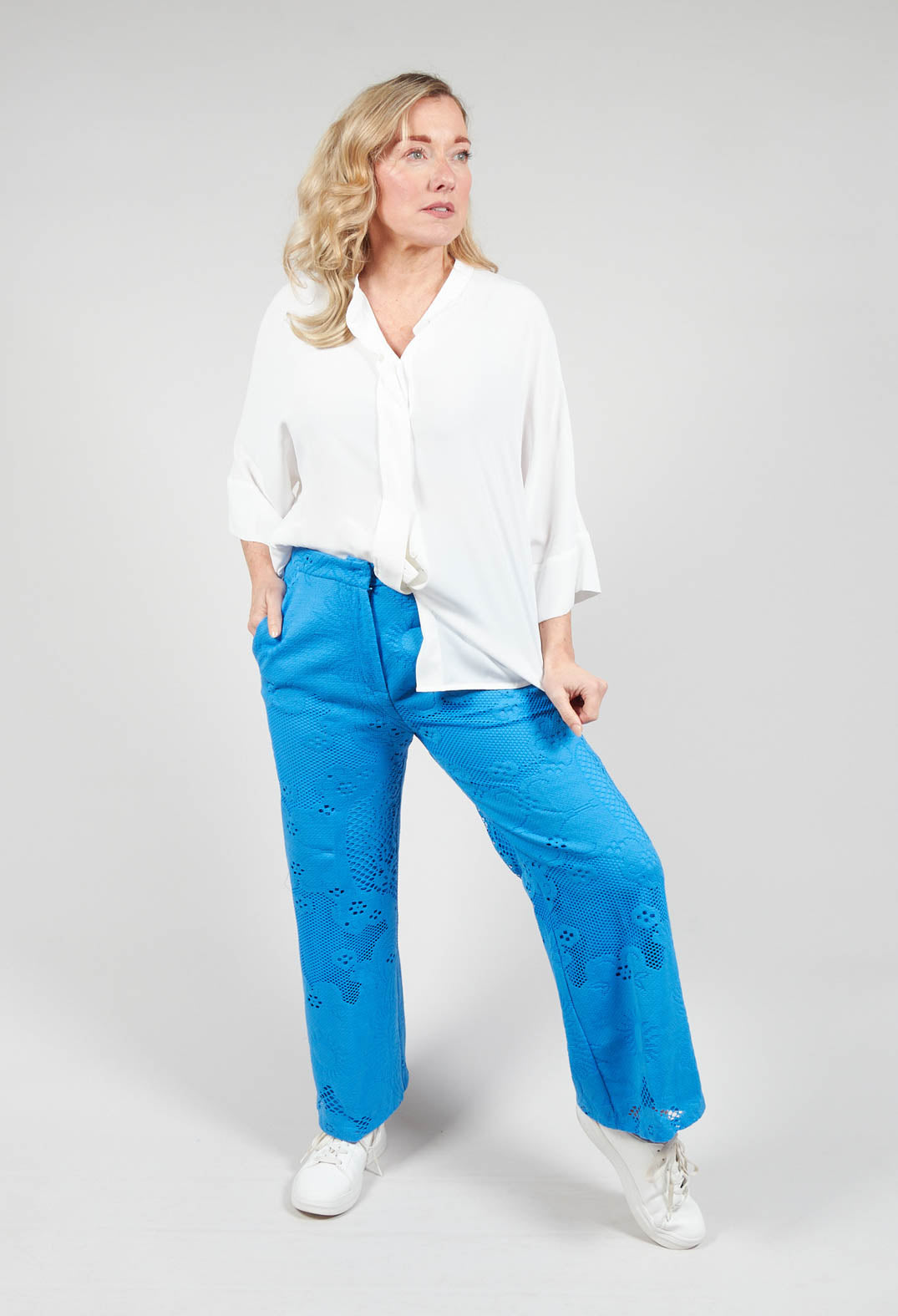 lady wearing Beatrice B straight leg trousers with lace detail in blue