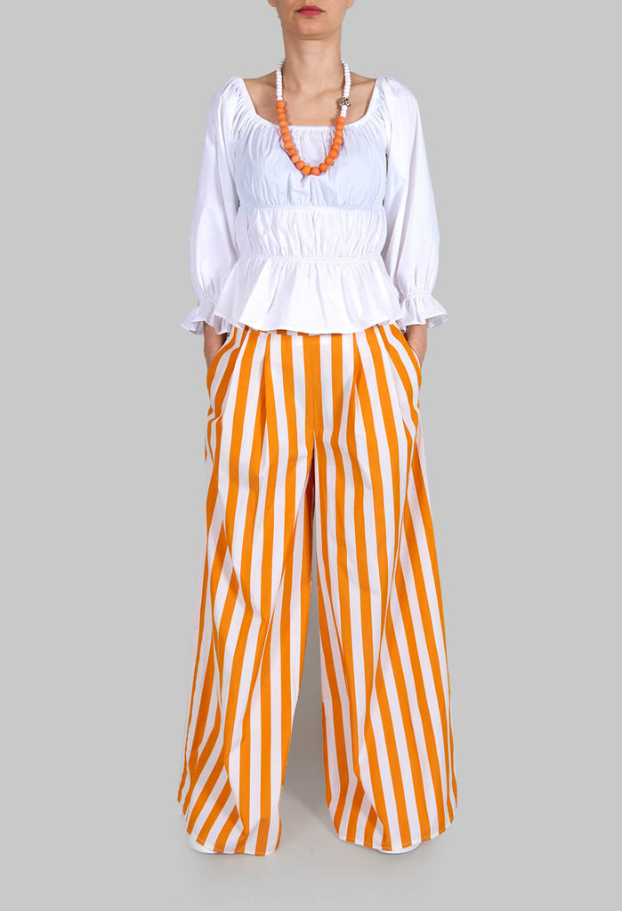 lady wearing Beatrice B white milkmaid blouse