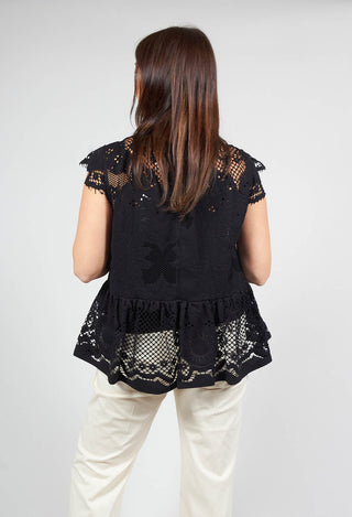 behind shot of black top with lace detail