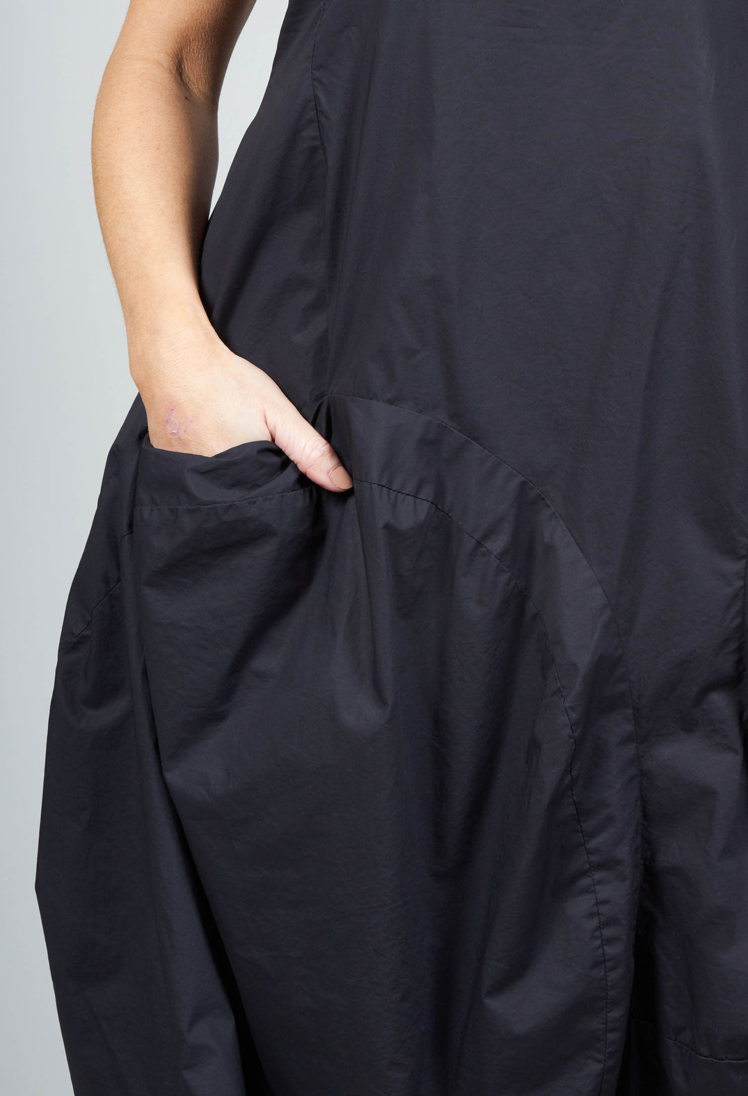 Tulip Hem Dress with Large Pockets in Black