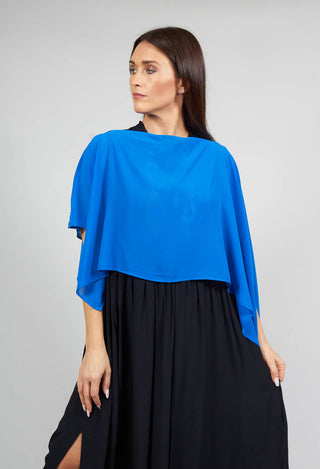 lady wearing cover up with waterfall sleeves in blue