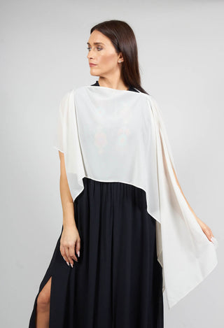 lady wearing Beatrice B waterfall sleeve cover up in tofu